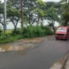 JALAN RUSAK TEMBUS 125 KM