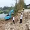 Jalan utama Desa Purwadana Amblas
